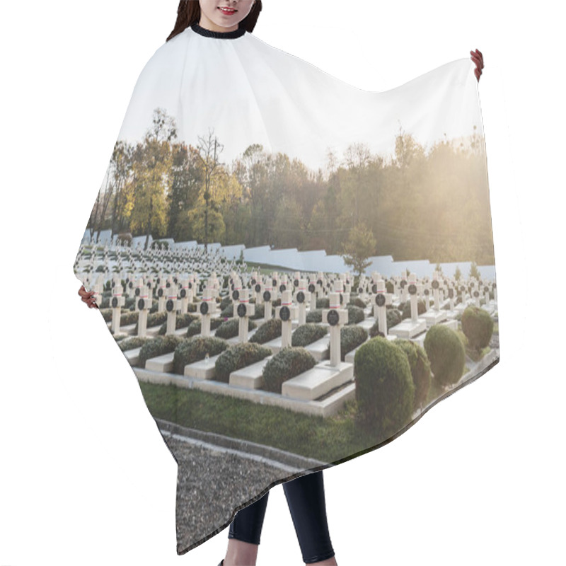 Personality  LVIV, UKRAINE - OCTOBER 23, 2019: Sunlight On Graveyard With Crosses And Lettering Near Green Trees On Lviv Defenders Cemetery  Hair Cutting Cape