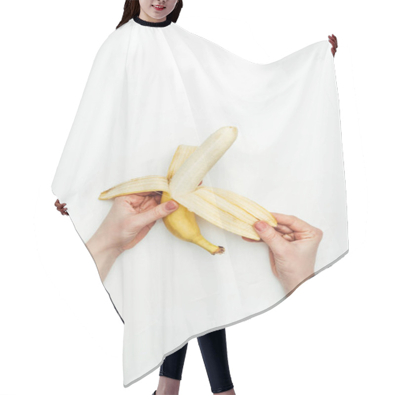 Personality  Cropped Image Of Woman Peeling Banana Isolated On White Hair Cutting Cape