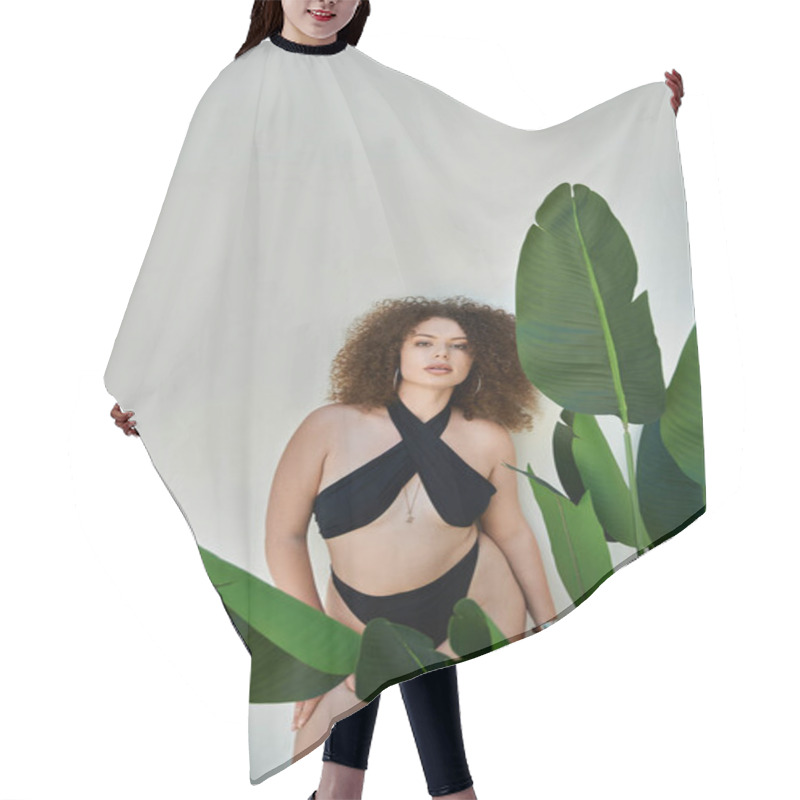 Personality  A Woman With Curly Hair Poses By A Pool In A Black Swimsuit, Framed By Lush Tropical Foliage. Hair Cutting Cape