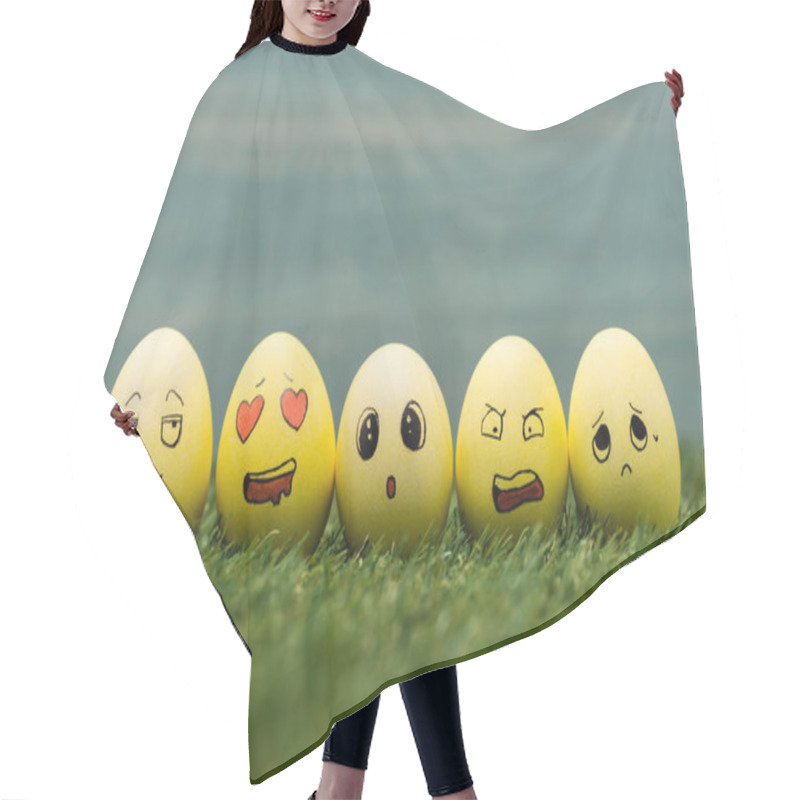 Personality  Easter Eggs With Different Facial Expressions On Grass  Hair Cutting Cape