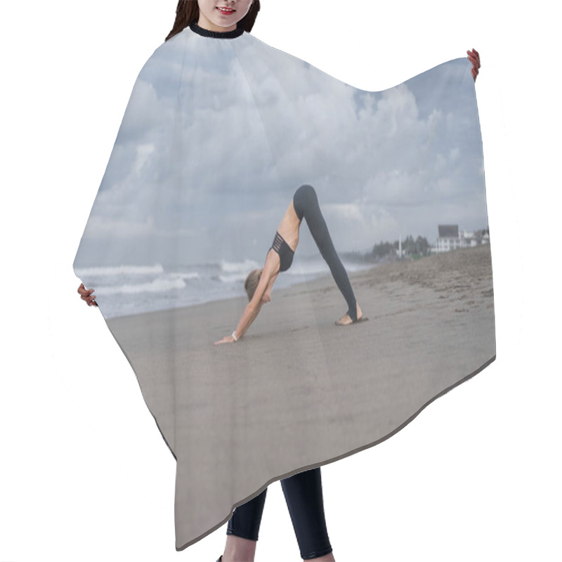 Personality  Young Woman Practicing Yoga In Downward-Facing Dog Pose (Adho Mukha Svanasana) On Seashore Hair Cutting Cape