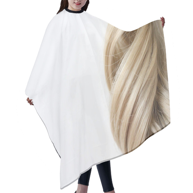 Personality  Beautiful Wavy Hair. Light Brown Hair. Hair Is Gathered In A Bun On A White Background. With Free Space For Text. For A Poster Or Business Card. Hair Cutting Cape