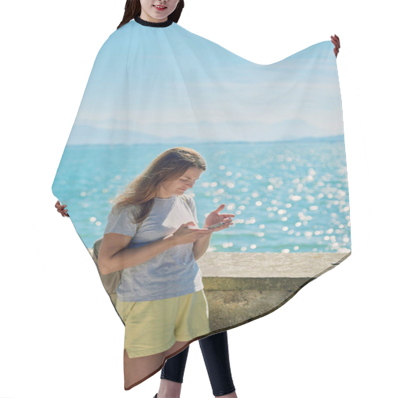 Personality  Woman Capturing Scenic Photos By A Sparkling Lake On A Sunny Day With Majestic Mountain Views. Idyllic Lakeside Setting Showcases Natural Beauty And Outdoor Adventure In A Serene European Landscape Hair Cutting Cape