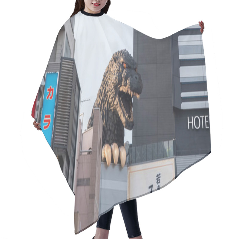 Personality  TOKYO, JAPAN - JUNE 30TH, 2018. Godzilla, Popular Japanese Pop Cilture Monster, Overlooking A Street In Kabukicho District, Shinjuku. Hair Cutting Cape