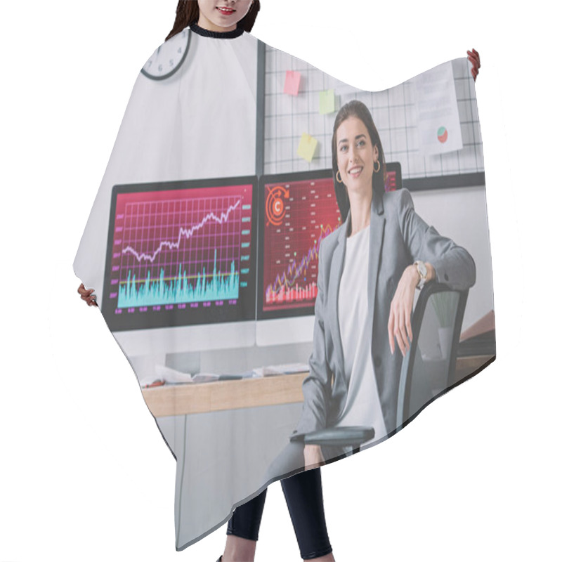 Personality  Smiling Computer Systems Analyst Looking At Camera Near Charts On Computer Monitors On Table  Hair Cutting Cape