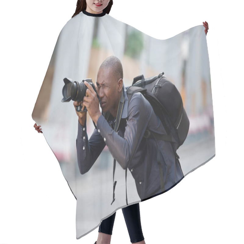 Personality  Young Man Photographer Takes A Picture Of The City And Its Buildings. Concept Of Travel And Tourism. Hair Cutting Cape