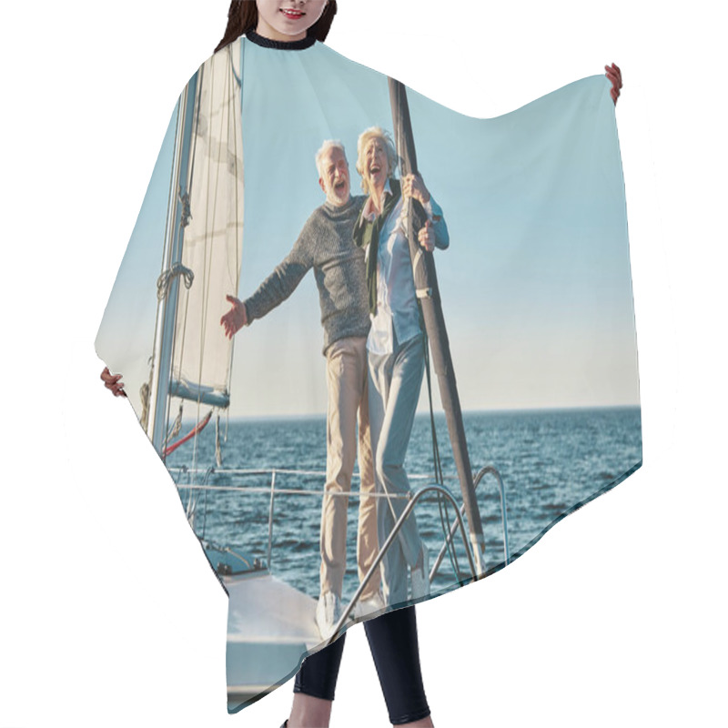 Personality  Feeling Happy Together. Full Length Of A Excited Retired Man And Woman, Senior Couple In Love Standing On The Side Of Yacht Deck Floating In Sea, Hugging And Laughing Hair Cutting Cape