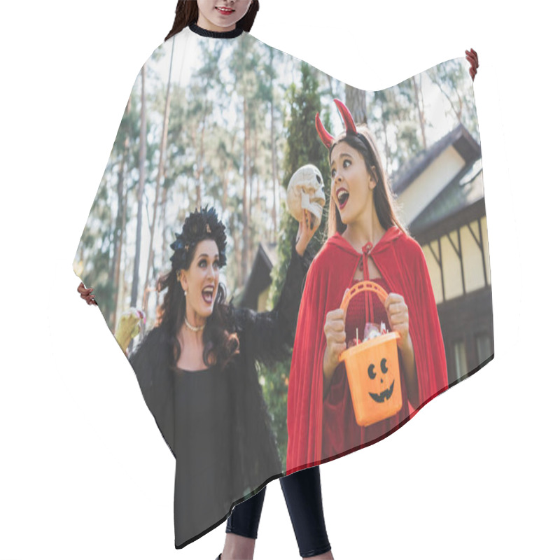 Personality  Woman In Vampire Halloween Costume Screaming And Scaring Daughter With Skull And Toy Hand Hair Cutting Cape