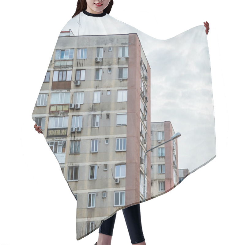 Personality  Worn Out Apartment Building From The Communist Era Against Blue Sky In Bucharest Romania. Ugly Traditional Communist Housing Ensemble Hair Cutting Cape