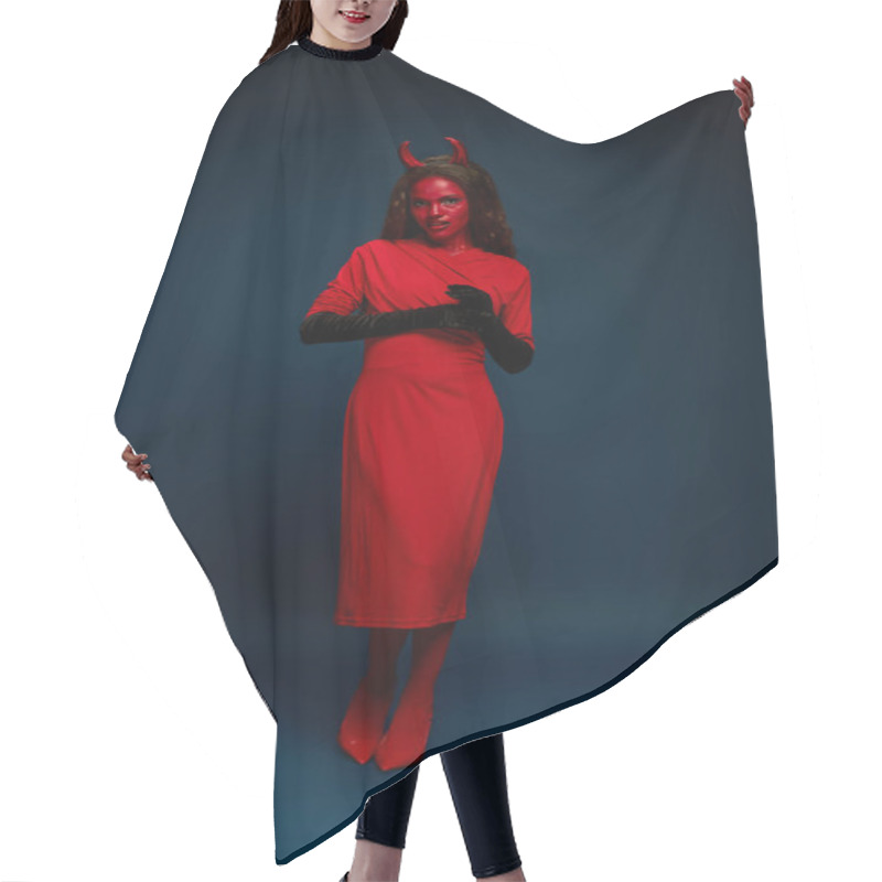 Personality  A Captivating Woman Dressed As A Devil Showcases Her Bold Halloween Outfit In A Stylish Pose. Hair Cutting Cape