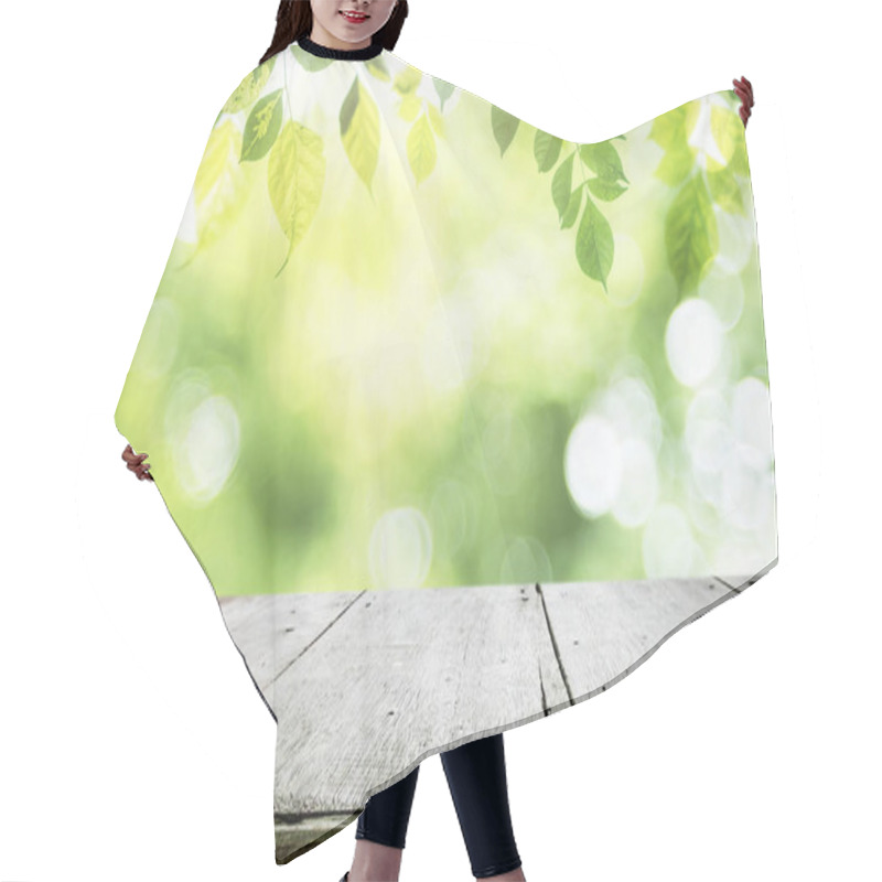 Personality  Empty Table For Present Product With Green Bokeh Background. Hair Cutting Cape