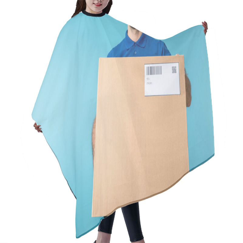 Personality  Cropped View Of Courier Holding Cardboard Box With Qr And Barcode On Card Isolated On Blue Hair Cutting Cape