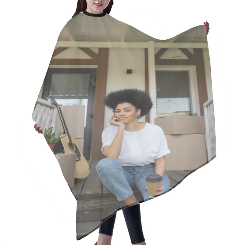 Personality  African American Woman Looking At Camera While Holding Coffee To Go On Porch Of New House Hair Cutting Cape