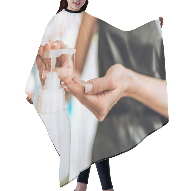 Personality  Close-up Partial View Of Young Hairstylist Holding Lotion In Beauty Salon Hair Cutting Cape