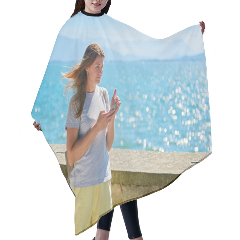 Personality  Woman Capturing Scenic Photos By A Sparkling Lake On A Sunny Day With Majestic Mountain Views. Idyllic Lakeside Setting Showcases Natural Beauty And Outdoor Adventure In A Serene European Landscape Hair Cutting Cape