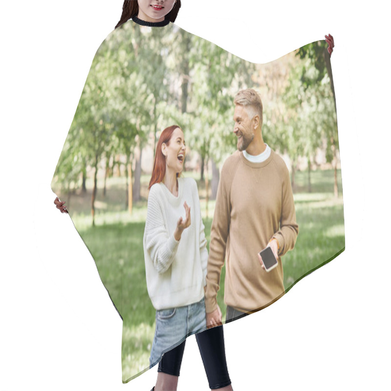 Personality  An Adult Loving Couple In Casual Attires Taking A Walk Through A Serene Park. Hair Cutting Cape