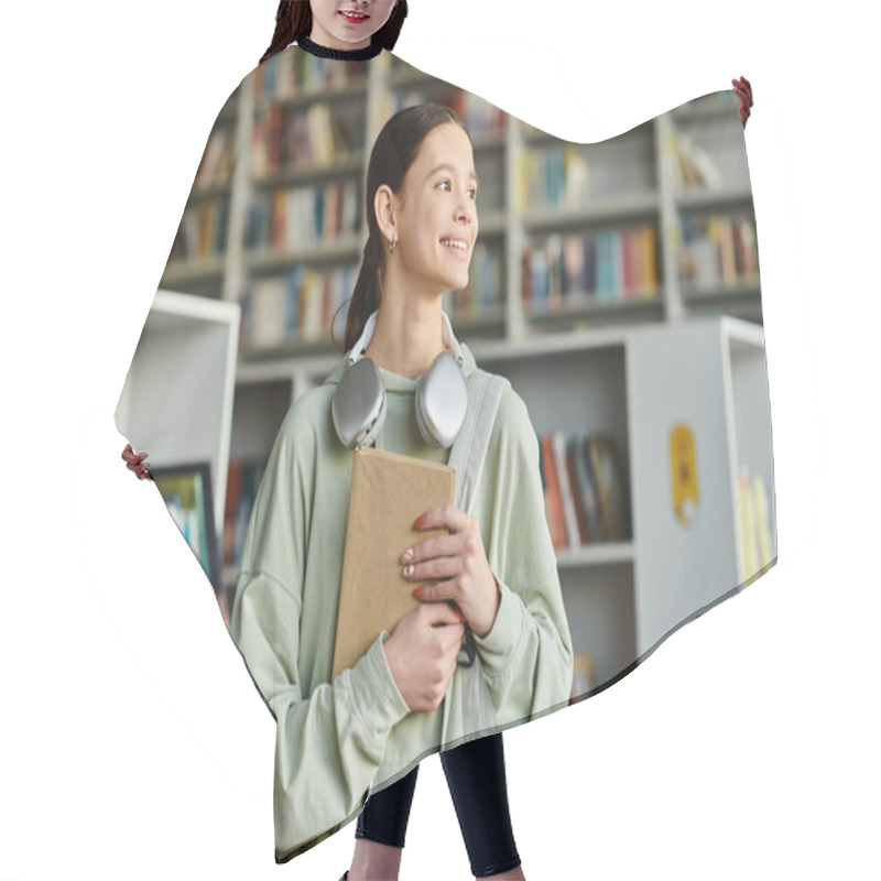 Personality  Teenage Girl In A Library, Engrossed In A Book While Engaging In After-school Study. Hair Cutting Cape