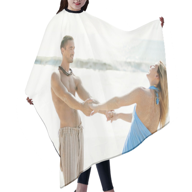 Personality  Young Couple Being Playful On A Beach Shore While On Honeymoon. Hair Cutting Cape