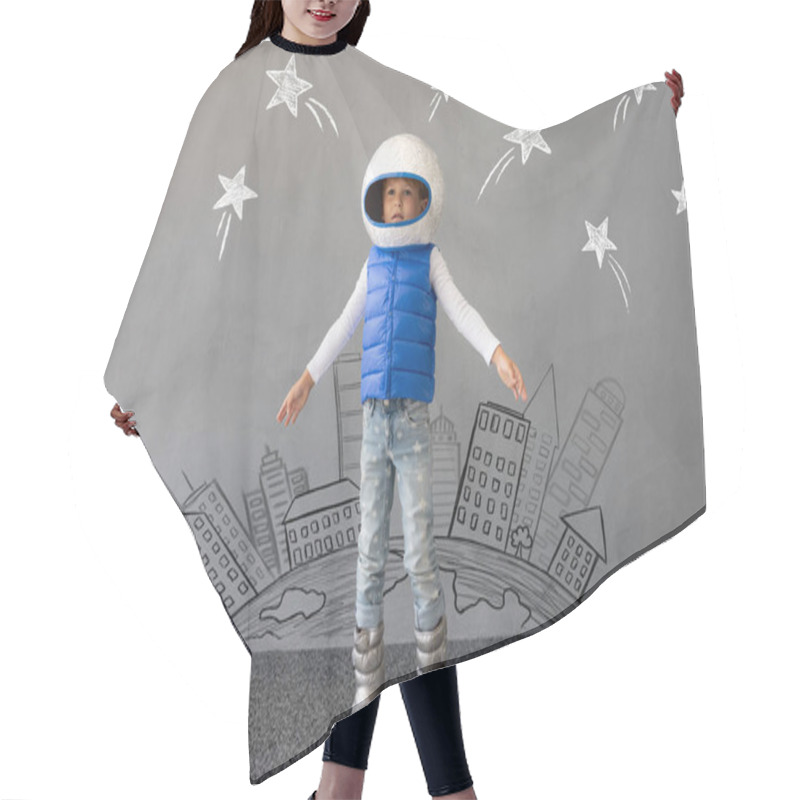 Personality  Happy Child Playing With Toy Rocket Against Concrete Wall Background. Kid Pretend To Be Astronaut. Imagination And Children Dream Concept Hair Cutting Cape