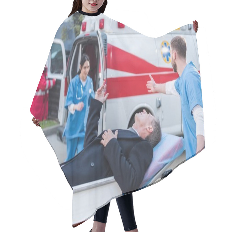 Personality  Injured Man And Doctor Asking Help Of Other Paramedic Hair Cutting Cape