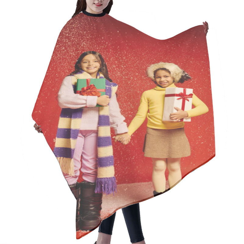 Personality  Two Little Girls In Cozy Winter Outfits Joyfully Hold Hands While Sharing Christmas Gifts. Hair Cutting Cape