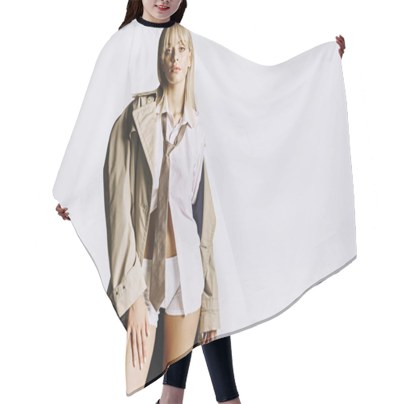 Personality  Stylish Woman Poses Confidently, Juxtaposing Short Shorts With A Trench Coat. Hair Cutting Cape