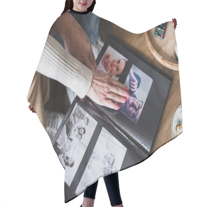 Personality  Cropped View Of Senior Couple Sitting Near Photo Album And Cup On Table Hair Cutting Cape