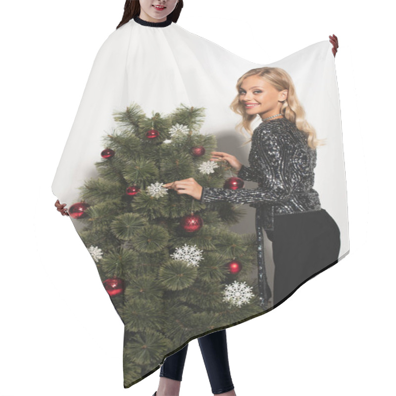 Personality  Happy And Stylish Woman Touching Decorative Snowflake On Christmas Tree On White Hair Cutting Cape