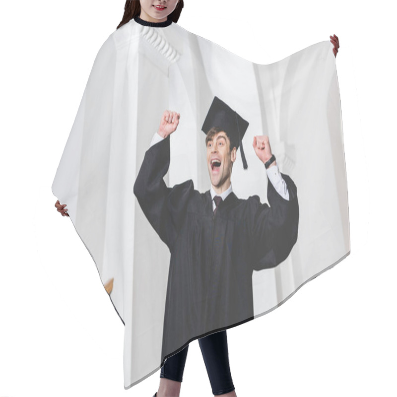 Personality  Happy Young Man In Graduation Cap Smiling And Gesturing In University  Hair Cutting Cape