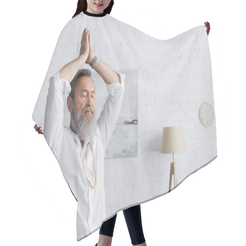 Personality  Senior Guru Man Meditating With Arms Up And Praying Hands At Home Hair Cutting Cape