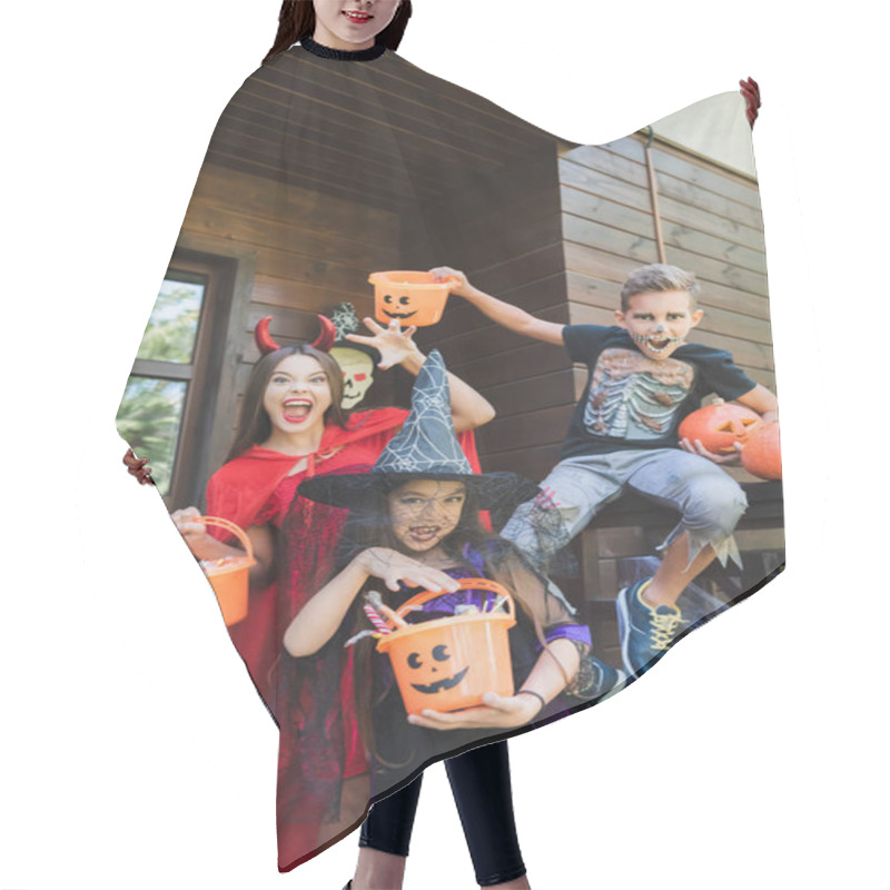 Personality  Kids In Creepy Halloween Costumes Showing Scary Gestures While Holding Buckets With Sweets On Cottage Porch Hair Cutting Cape