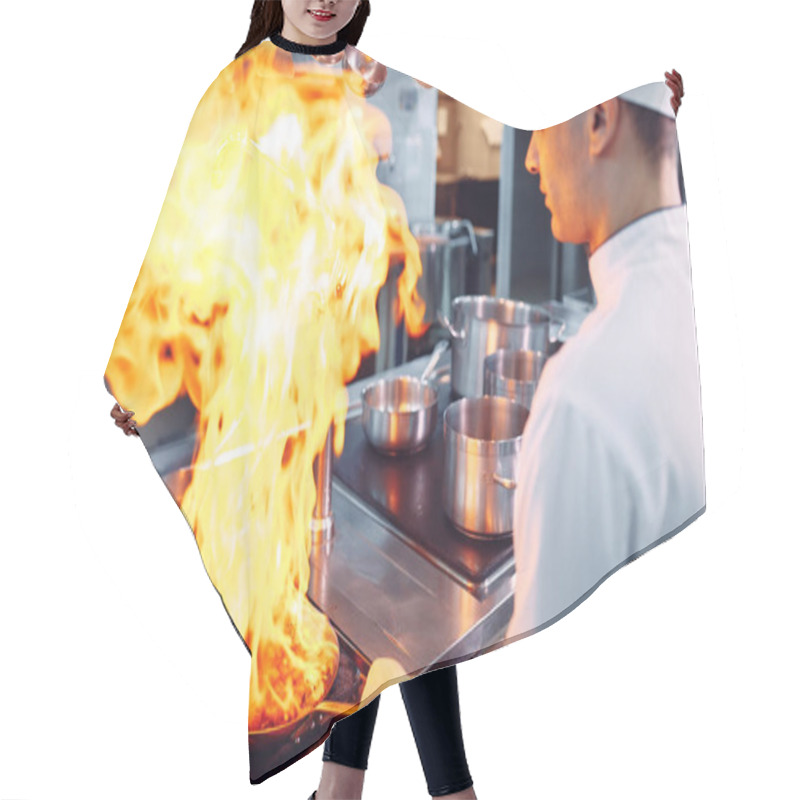 Personality  Modern Kitchen. Cooks Prepare Meals On The Stove In The Kitchen Of The Restaurant Or Hotel. The Fire In The Kitchen. Hair Cutting Cape