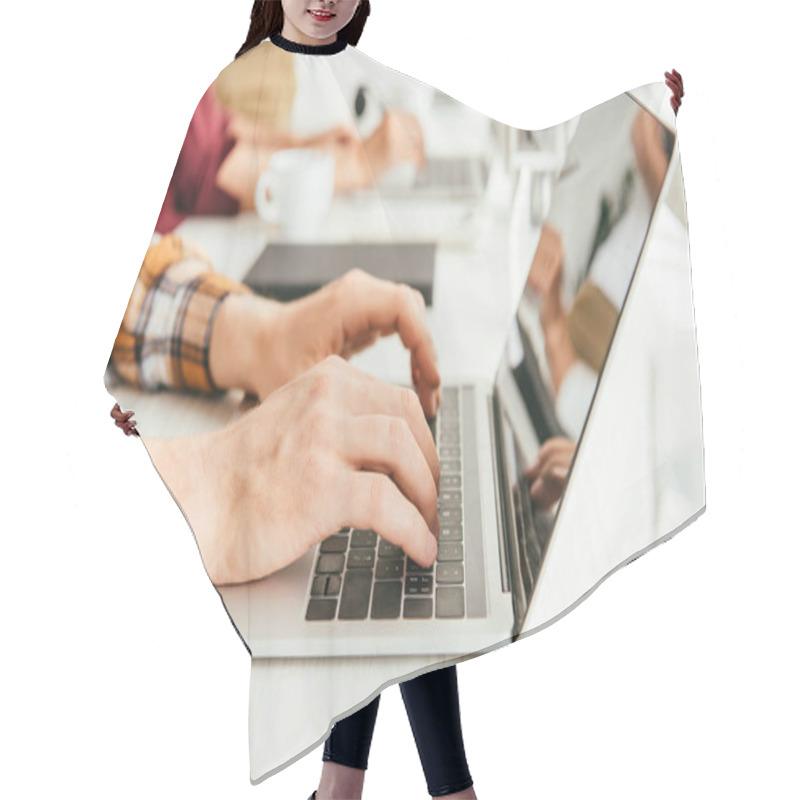 Personality  Selective Focus Of Broker Typing On Laptop Keyboard Near Woman In Office  Hair Cutting Cape