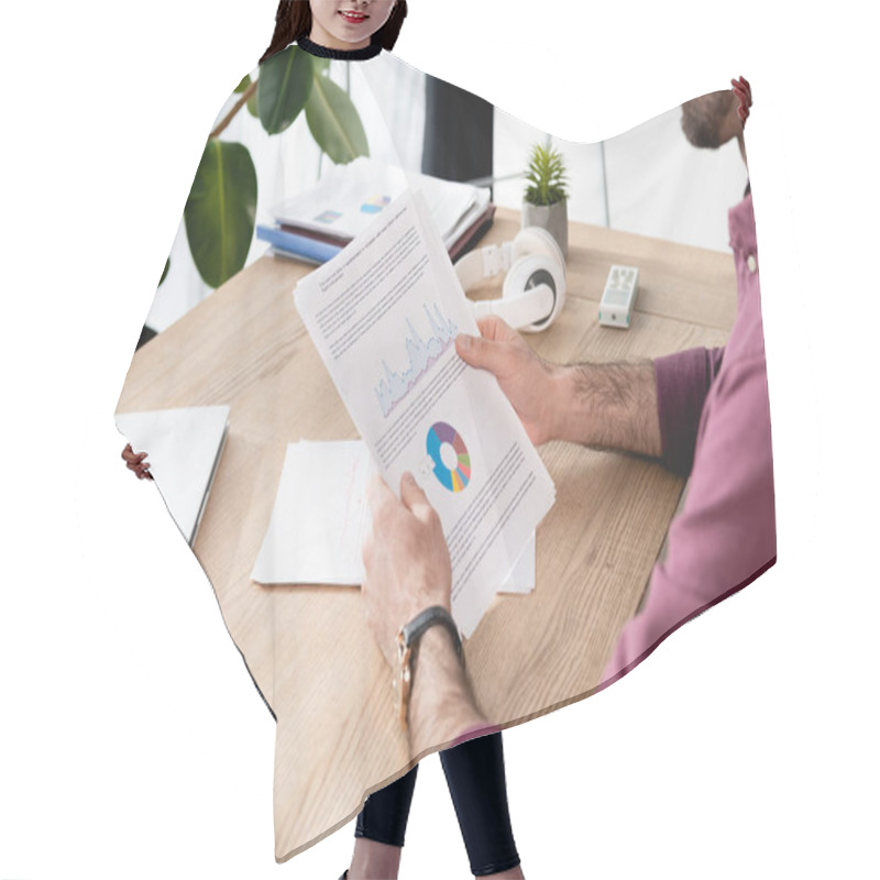 Personality  Cropped View Of Businessman Holding Paper With Analytics Near Laptop And Wireless Headphones Hair Cutting Cape