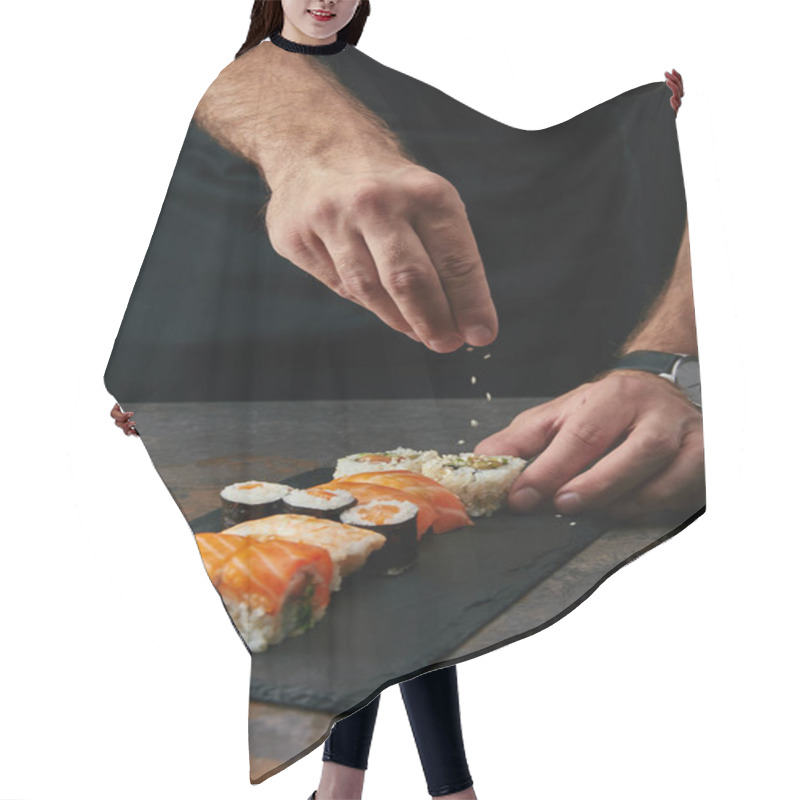 Personality  Partial View Of Chef Pouring Sesame Seeds On Arranged Sushi Set On Slate Plate On Dark Tabletop Hair Cutting Cape