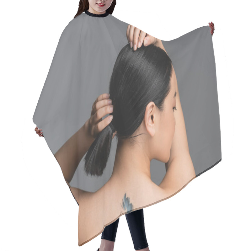 Personality  Side View Of Pretty Asian Woman With Tattoo On Back Touching Hair Isolated On Grey  Hair Cutting Cape