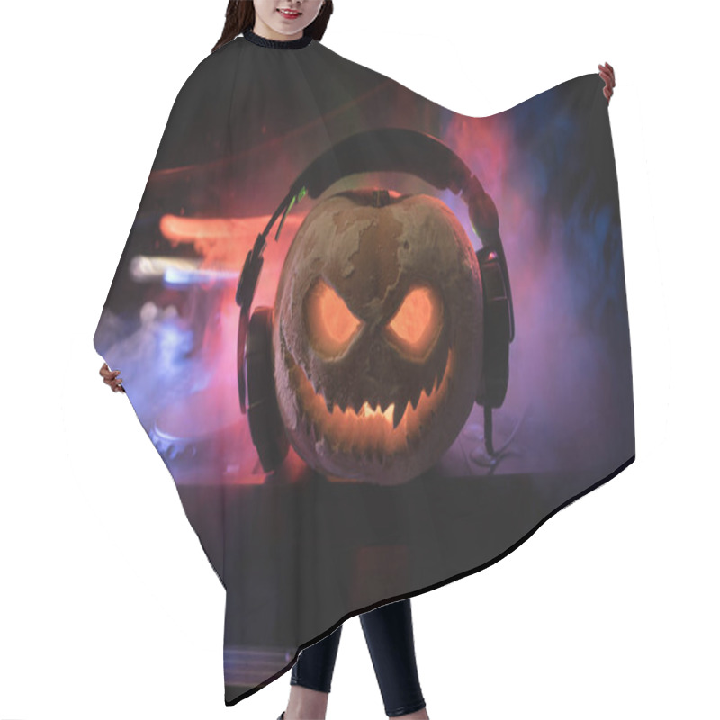 Personality  Halloween Pumpkin On A Dj Table With Headphones On Dark Background With Copy Space. Happy Halloween Festival Decorations And Music Concept Hair Cutting Cape