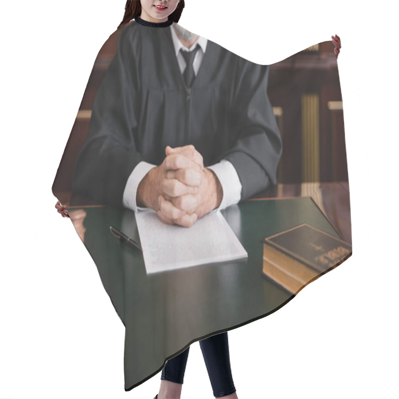 Personality  Partial View Of Judge Sitting With Clenched Hands Near Bible, Gavel And Lawsuit On Desk Hair Cutting Cape