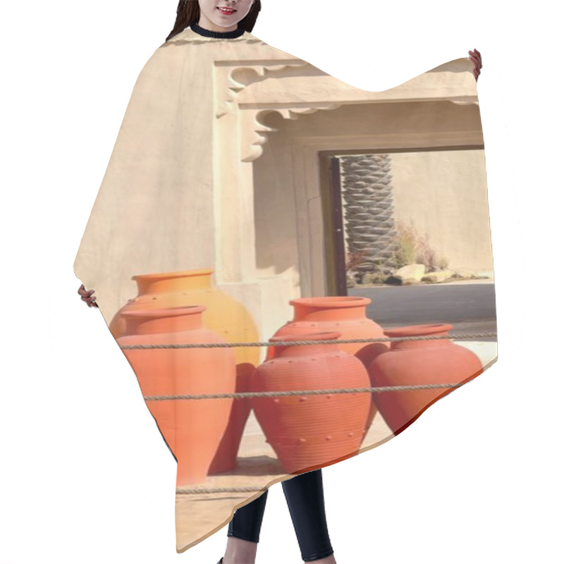 Personality  Vertical Screen:Traditional Desert Pottery Highlights Clay Craftsmanship With Backdrop Of Traditional Arabic Design Building Pottery Symbolizes Cultural Artistry Blending Heritage With Timeless Design Hair Cutting Cape