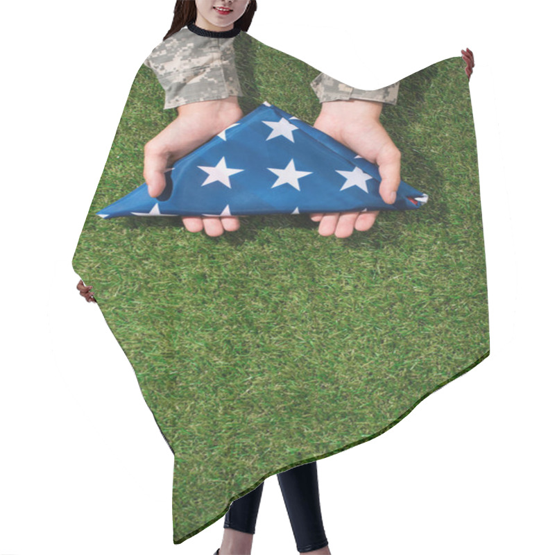 Personality  Partial View Of Soldier In Military Uniform Holding Folded Flag In Hands On Green Grass, 4th July Holiday Concept Hair Cutting Cape