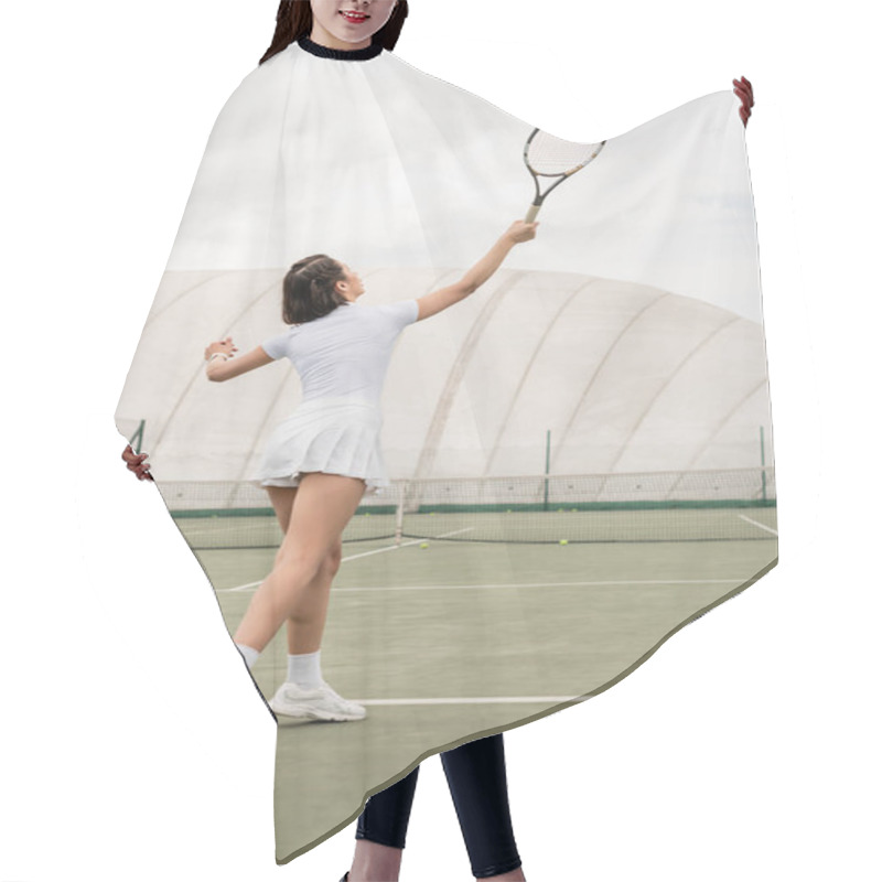 Personality  Motivation And Sport, Back View Of Sportswoman Hitting The Ball While Playing Tennis On Court Hair Cutting Cape