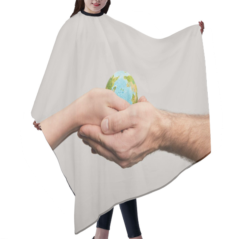 Personality  Man And Woman Holding Planet Model On Grey Background, Earth Day Concept Hair Cutting Cape