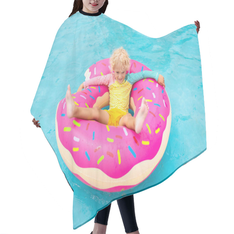 Personality  Child In Swimming Pool On Funny Inflatable Donut Float Ring. Little Boy Learning To Swim In Outdoor Pool Of Tropical Resort. Water Toys For Kids. Healthy Sport Activity For Children. Sun Protection.  Hair Cutting Cape