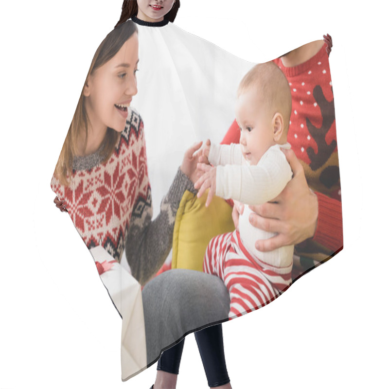 Personality  Happy Woman Holding Wrapped Christmas Present Near Husband And Baby Son With Outstretched Hands  Hair Cutting Cape