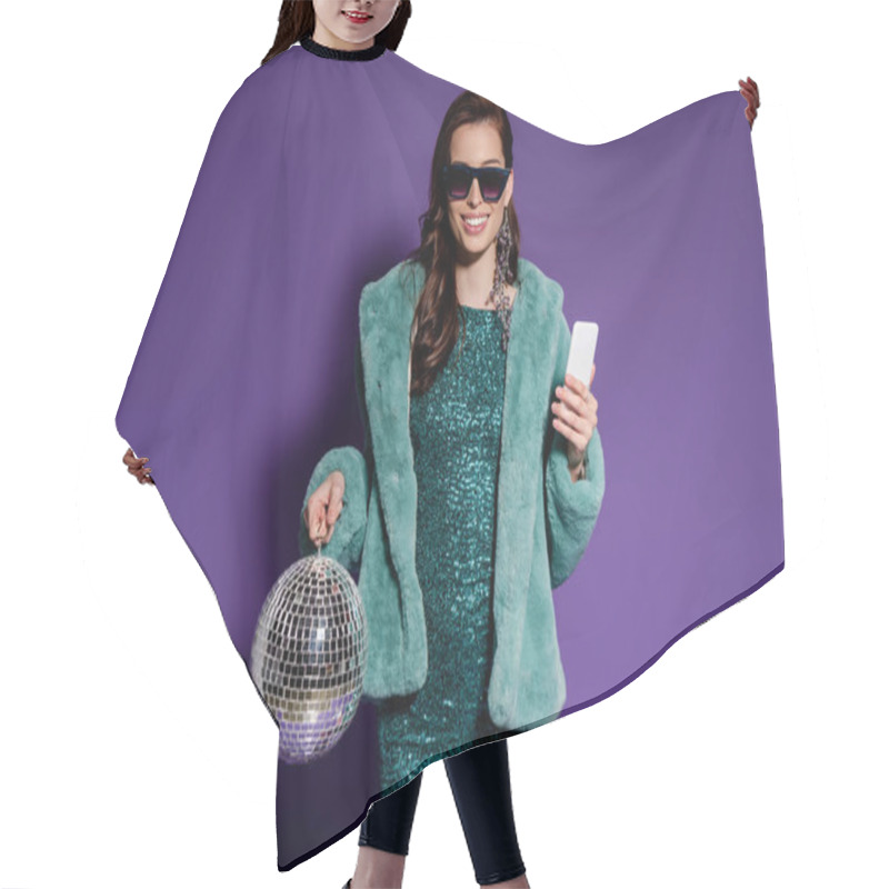 Personality  Cheerful Girl In Sunglasses Holding Smartphone And Disco Ball On Purple  Hair Cutting Cape