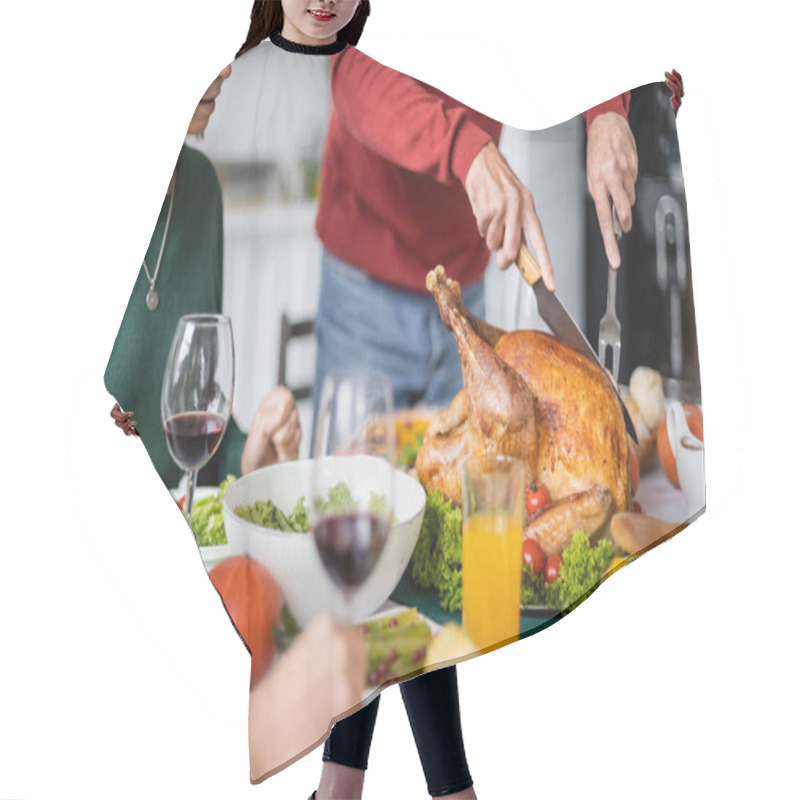 Personality  Cropped View Of Senior Man Cutting Delicious Thanksgiving Turkey Near Women And Wine At Home  Hair Cutting Cape