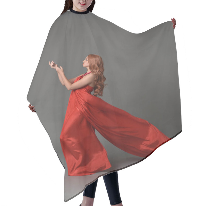 Personality  Full Length Portrait Of Woman Wearing A Red Silk Dress, Standing Pose On Grey Studio Background. Hair Cutting Cape