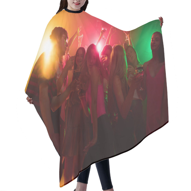 Personality  A Crowd Of People In Silhouette Raises Their Hands On Dancefloor On Neon Light Background Hair Cutting Cape