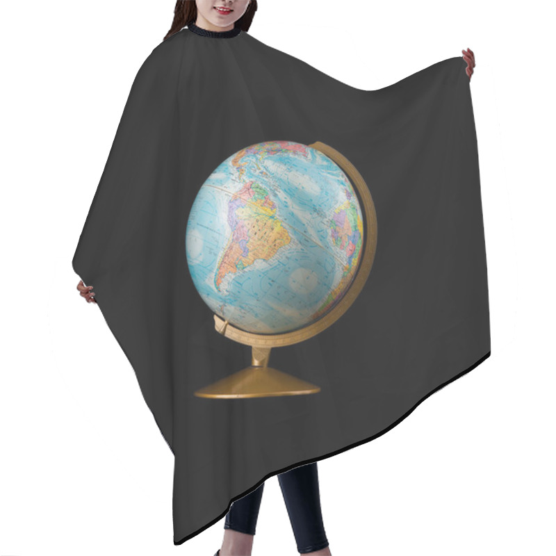 Personality  Globe Model Isolated On Black Background. Empty Space For Copy, Room For Text. Minimalist Style Travel Concept. Hair Cutting Cape