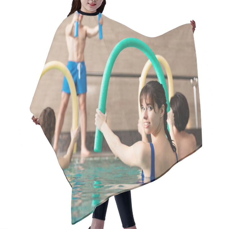 Personality  Selective Focus Of Woman Smiling At Camera While Holding Pool Noodle During Water Aerobics Hair Cutting Cape